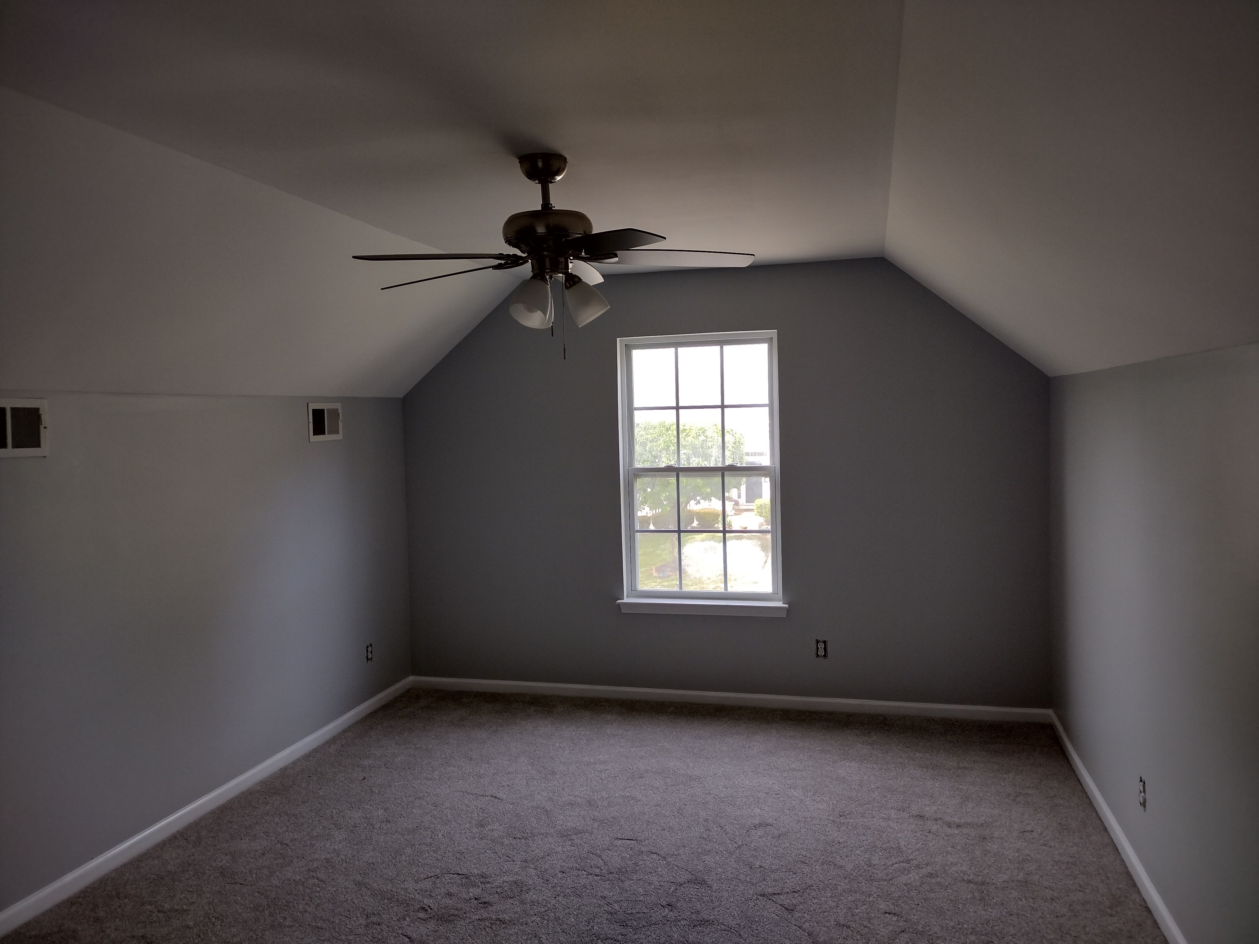 Bonus room after painting — finished gray walls and white trim