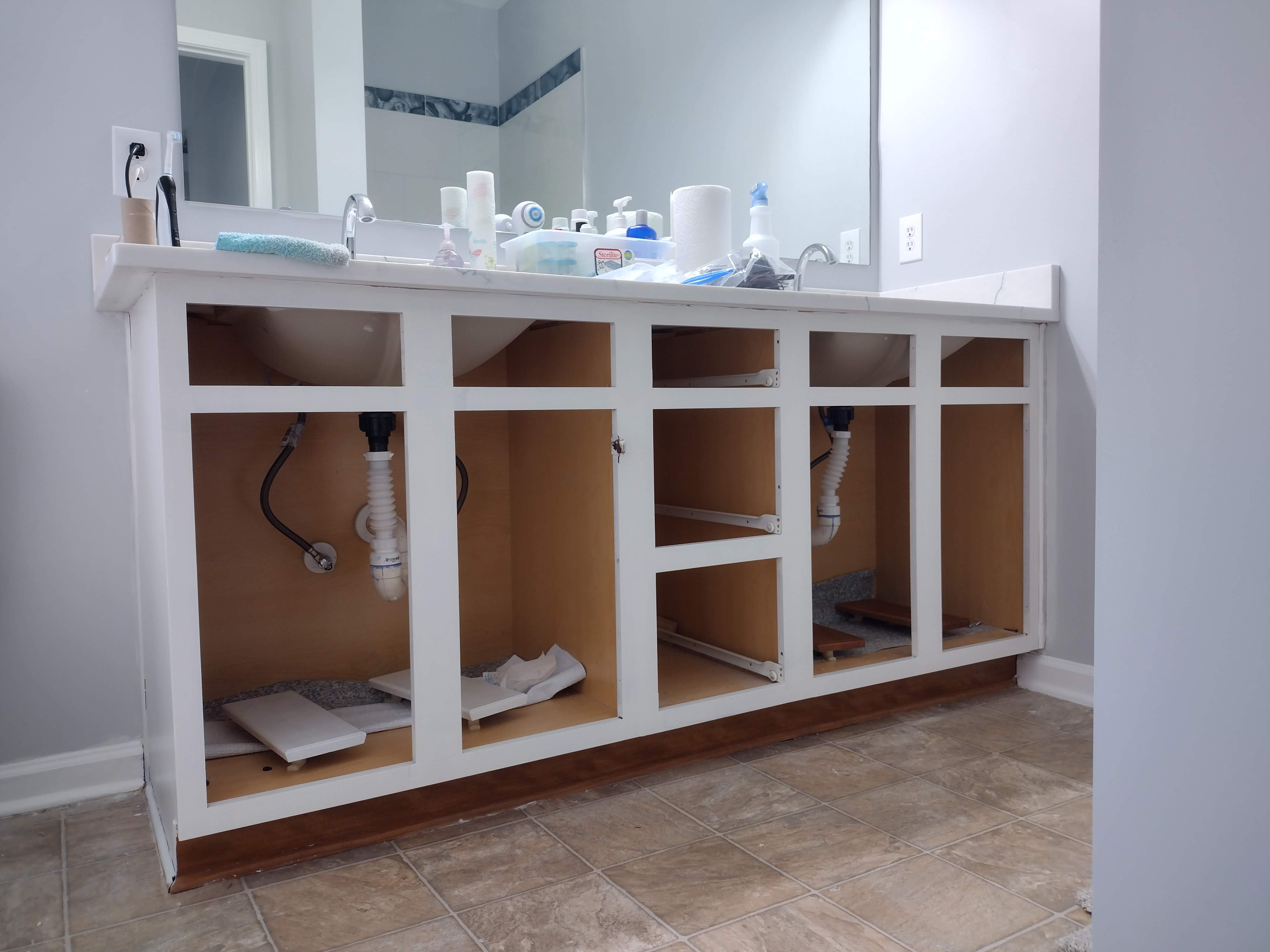 Bathroom vanity during refinishing — primer coat