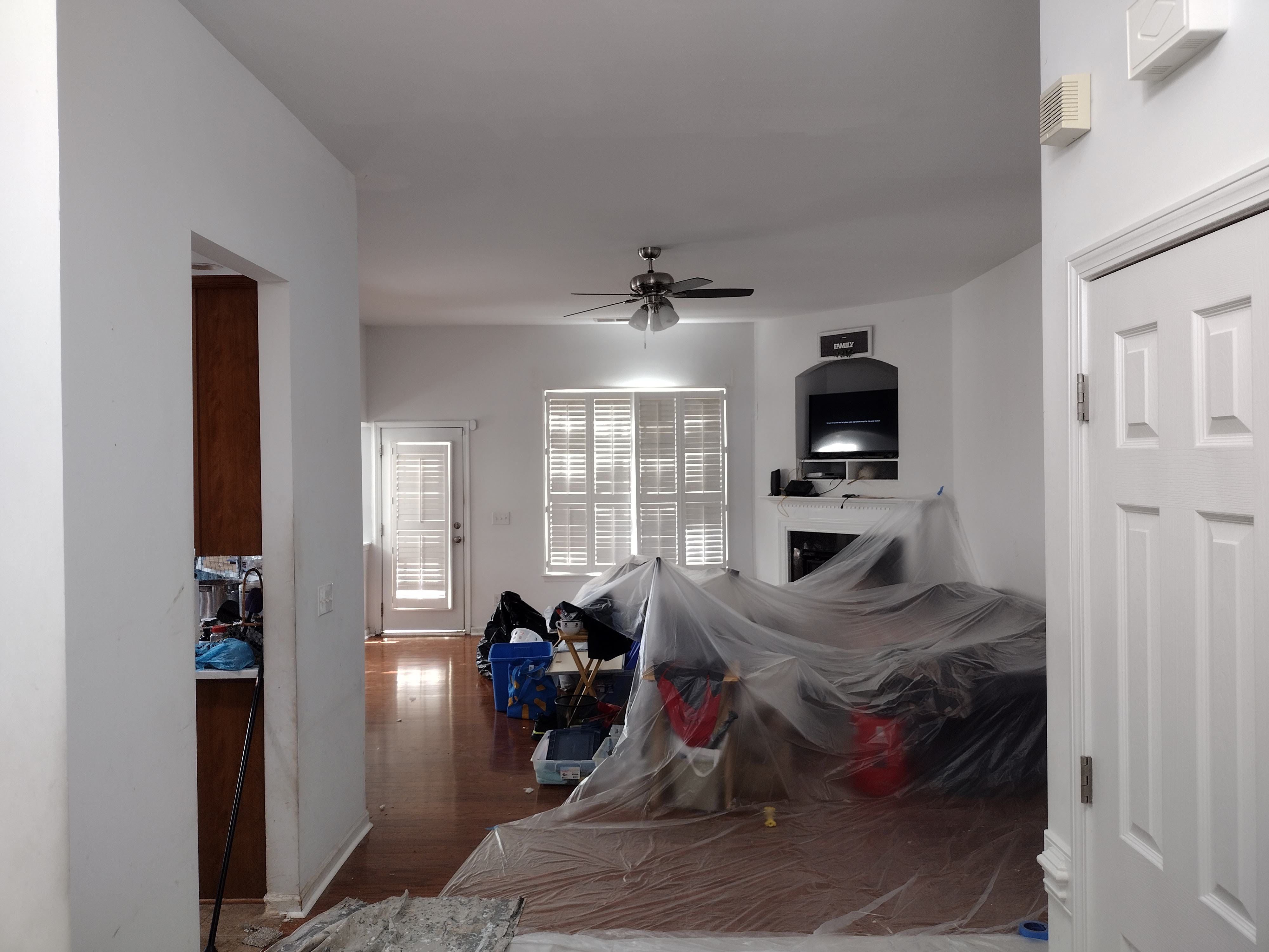 Furniture and floors protected before painting begins